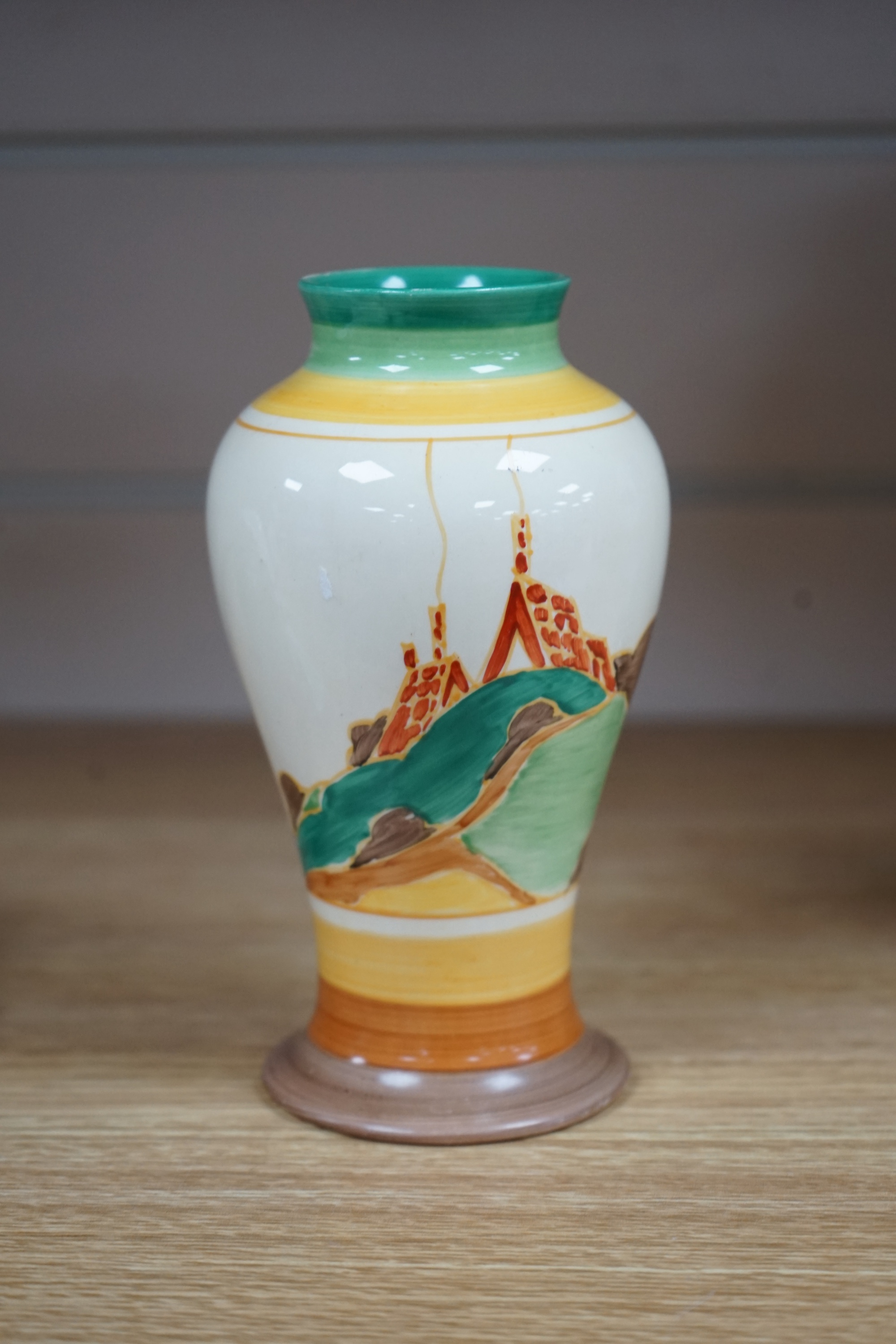 A Clarice Cliff Bizarre ‘Secrets’ pattern vase, circa mid-1930s, 16cm. Condition - restored chip to rim